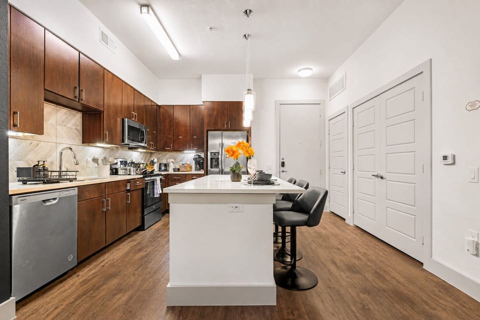 Modern kitchen with island seating and sleek stainless appliances