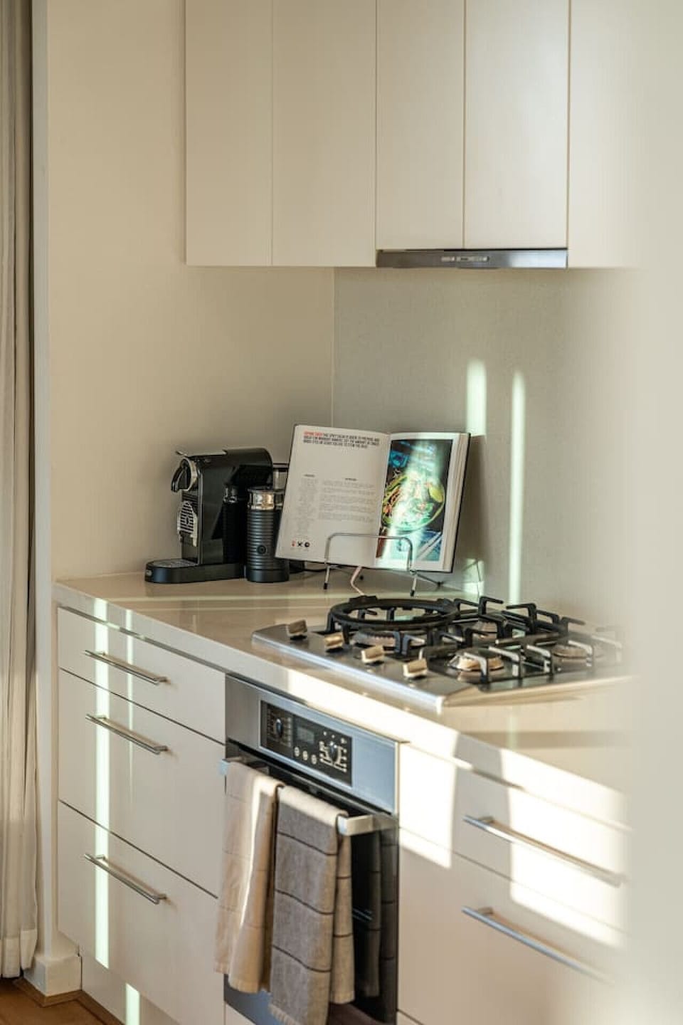 Start the day with a freshly brewed coffee from the Nespresso machine, thoughtfully positioned within the kitchen for slow mornings before heading out to explore the city.