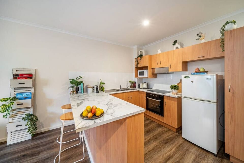 Ease into your morning in the kitchen, enjoying coffee at the breakfast bar before heading out.