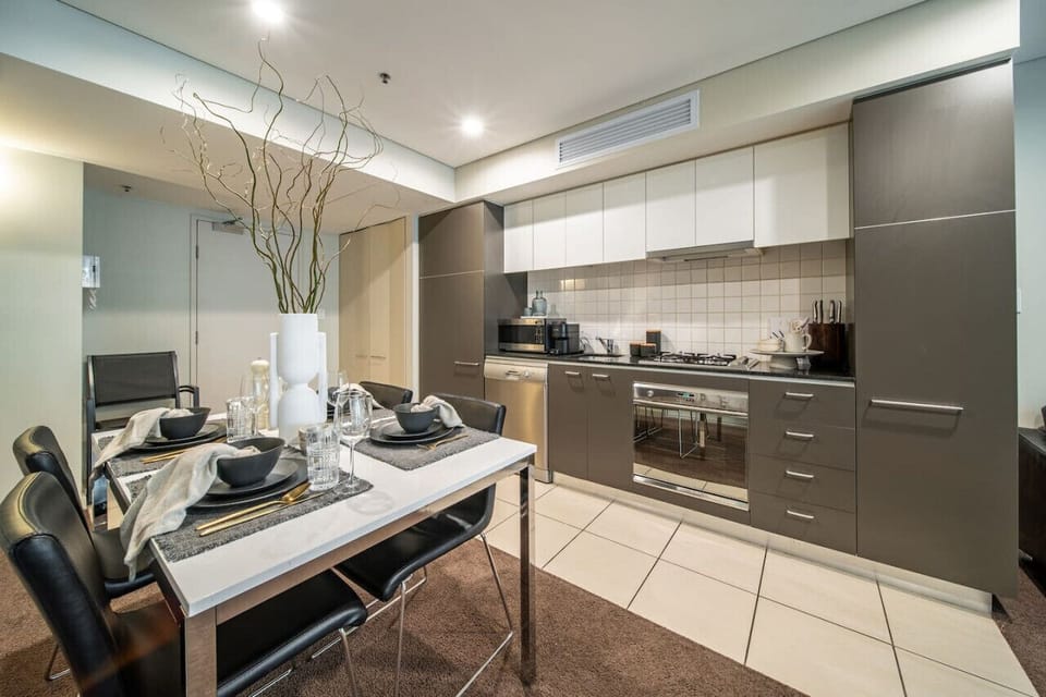 Prepare meals with ease in the sleek kitchen with modern finishes.