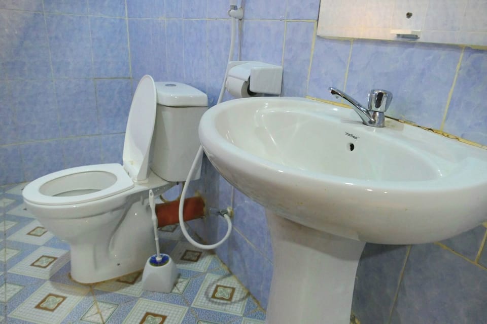 Standard Single Room, Garden View | Bathroom | Shower, slippers, towels, soap