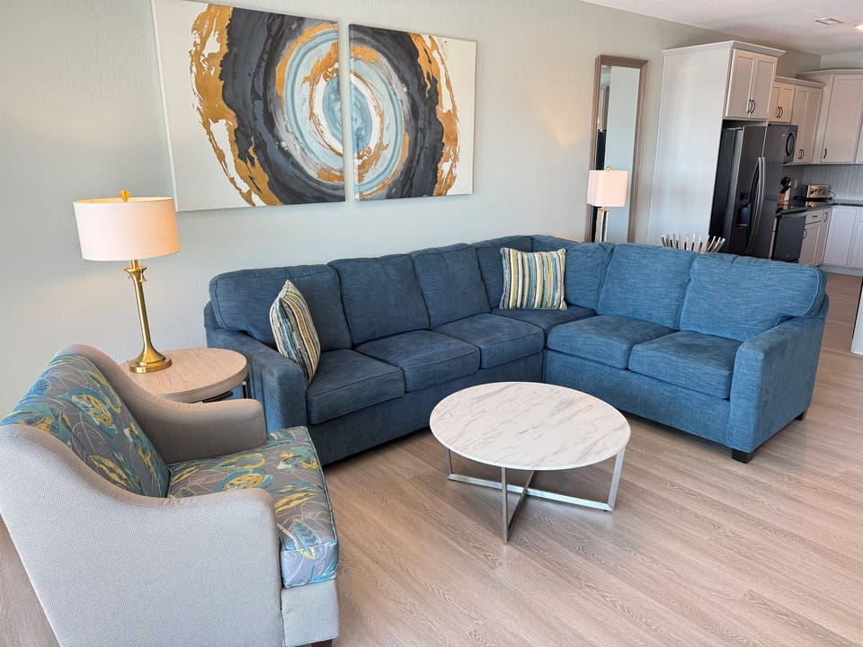 Large sectional and several chairs