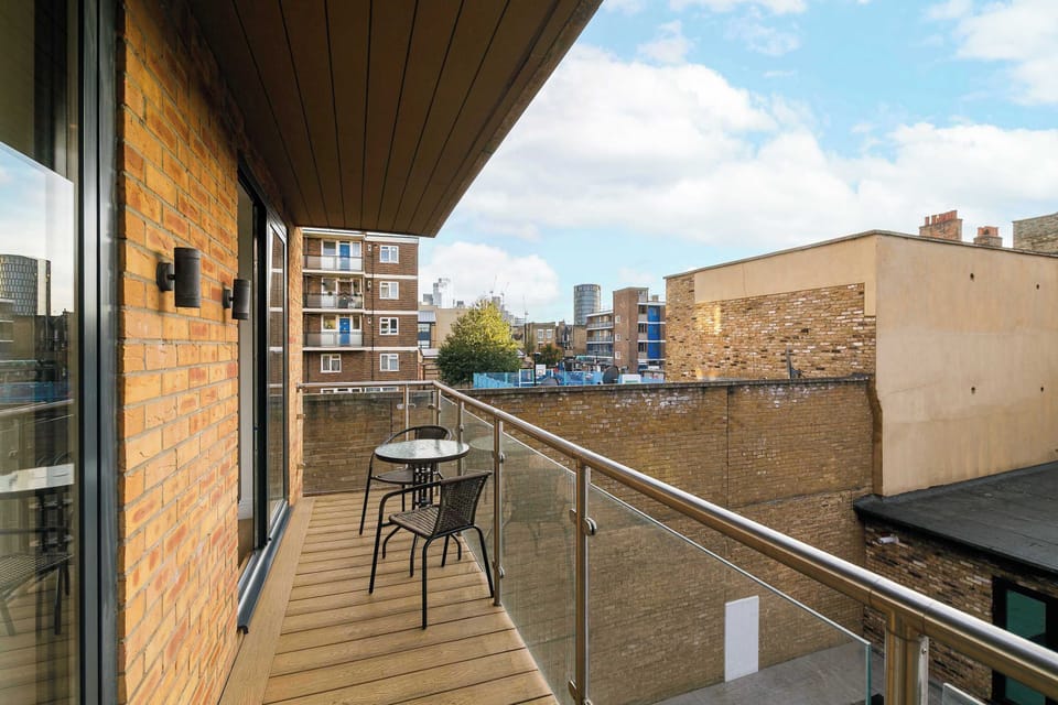 Private balcony in Shoreditch — enjoy open-air city views, morning sunlight and an evening glass of wine