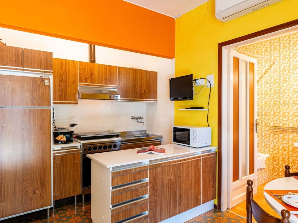 Kitchen, Major Appliance, Kitchen Appliance, Wood, Countertop, Interior Design, Cabinetry, Flooring, Furniture, Orange