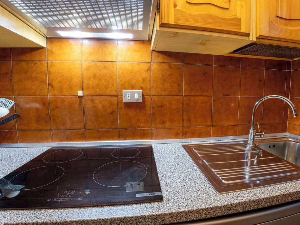 Kitchen, Countertop, Major Appliance, Kitchen Appliance, Flooring, Kitchen Sink, Kitchen Stove, Floor, Interior Design, Stove