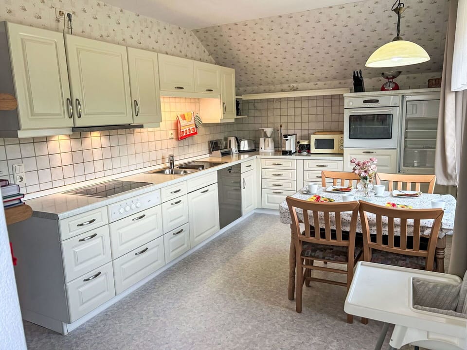 Kitchen, Countertop, Cabinetry, Kitchen Appliance, Furniture, Major Appliance, Interior Design, Wood, Kitchen Stove, Drawer