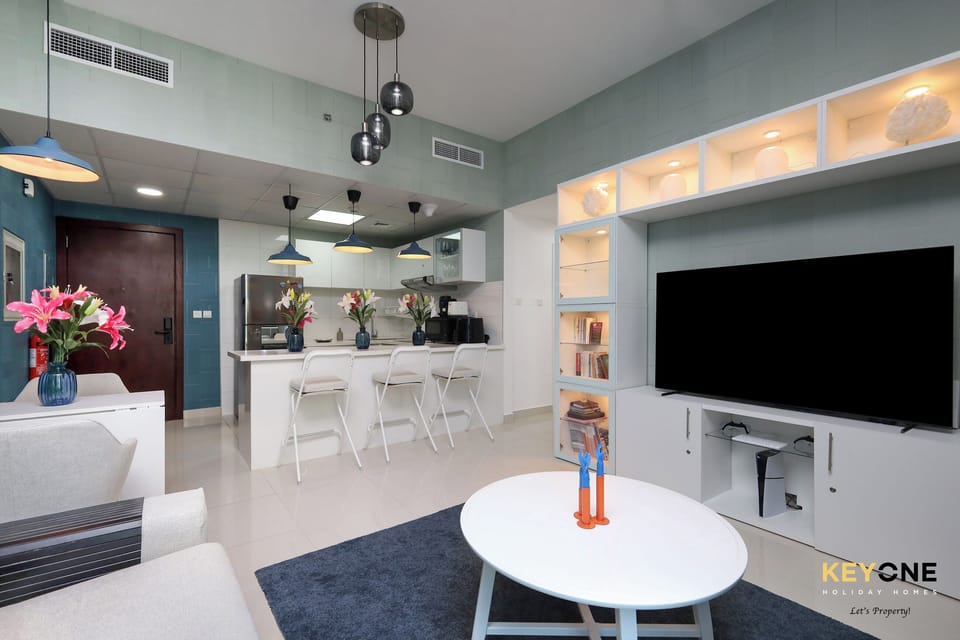 Deluxe Apartment, Partial Sea View | Living area | Computer monitors