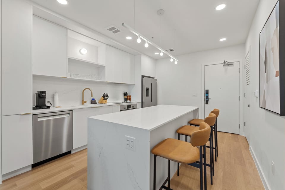 Sleek dining area with a high-top table, perfect for morning coffee or a casual dinner.