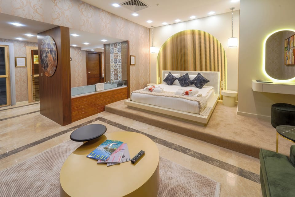 Comfort Studio Suite | Living area | 90-inch Smart TV with cable channels, Netflix, streaming services