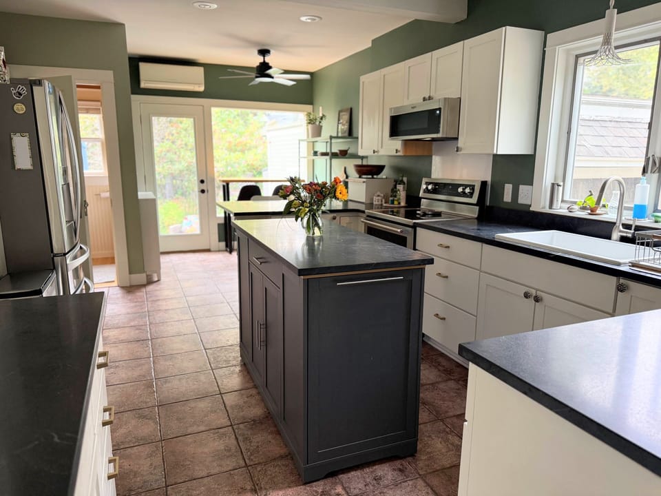 Fully equipped kitchen with soap stone counters