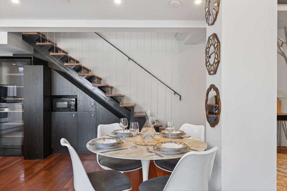 A cosy dining area with seating for four, ideal for family dinners or friendly get-togethers.