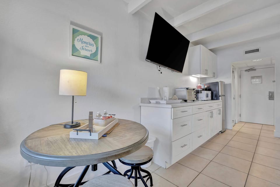 Late-night snacks and movies in your stylish kitchenette!