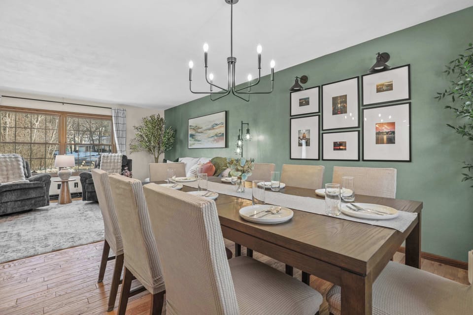 Dining room with table that comfortably seats 8. It is attached to the kitchen which has 4 barstool spots.