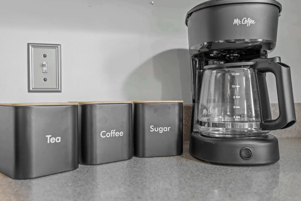 Fully stocked kitchen, with 4 barstools overlooking the backyard. We have a children's clip on high chair, kids dinnerware, complimentary coffee, tea, sugar, and creamer, as well as all your cooking needs on site.