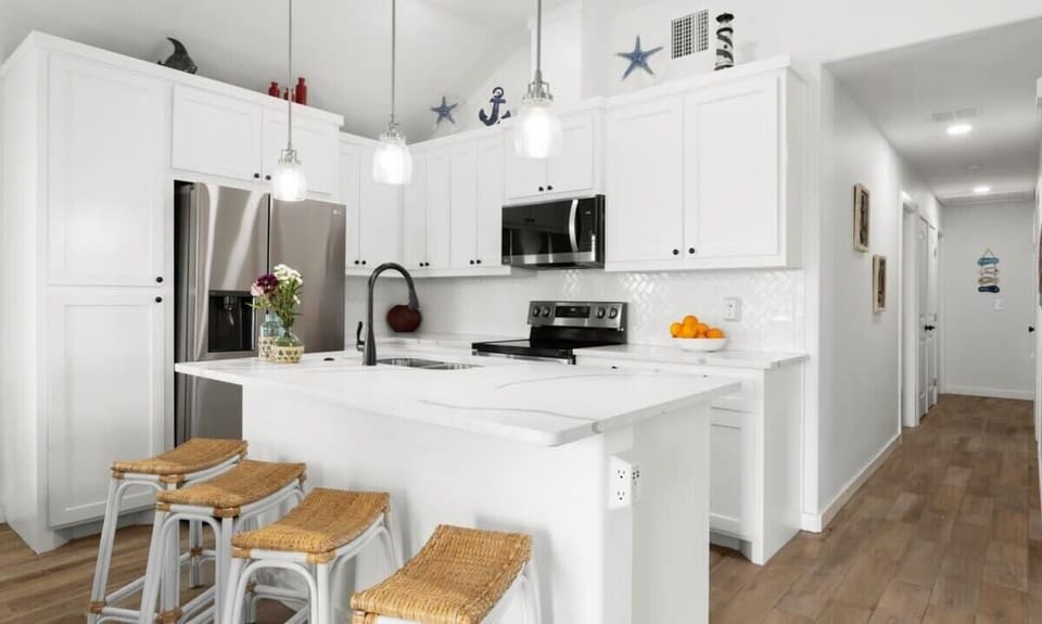 Kitchen — White Cabinets, Quartz Island, Herringbone Backsplash, Pendants & Stainless Appliances