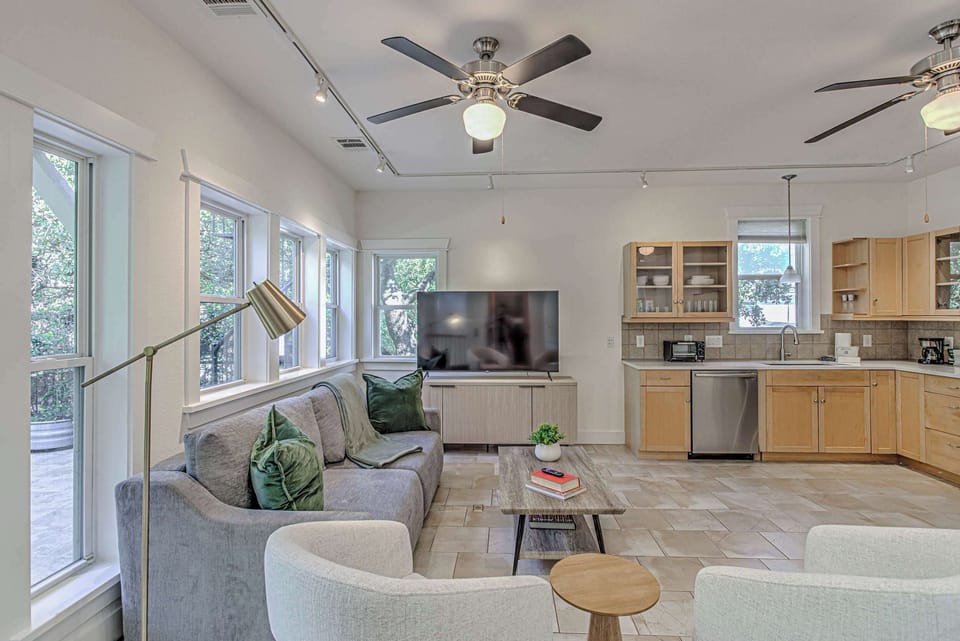 Bright, fully equipped kitchen with stainless steel appliances.