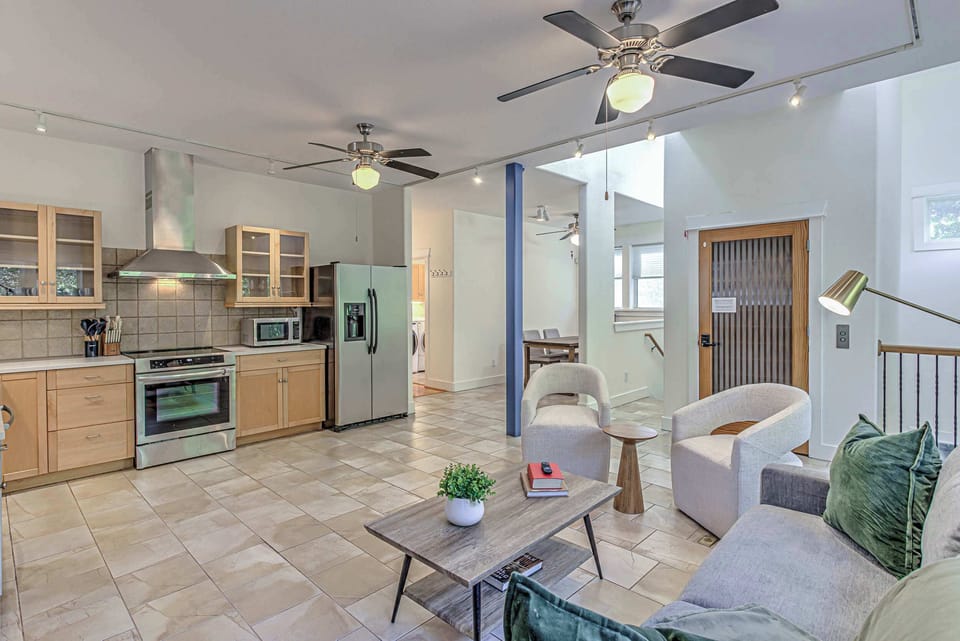 Sunlit, open concept living/kitchen space.