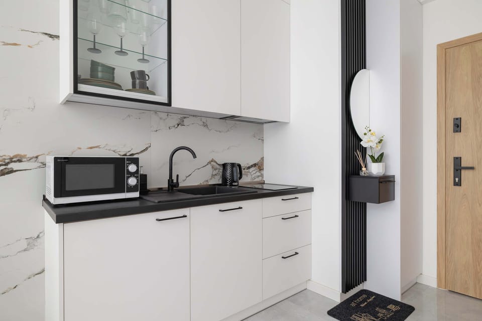 Fully equipped kitchenette with contemporary finishes and smart design.