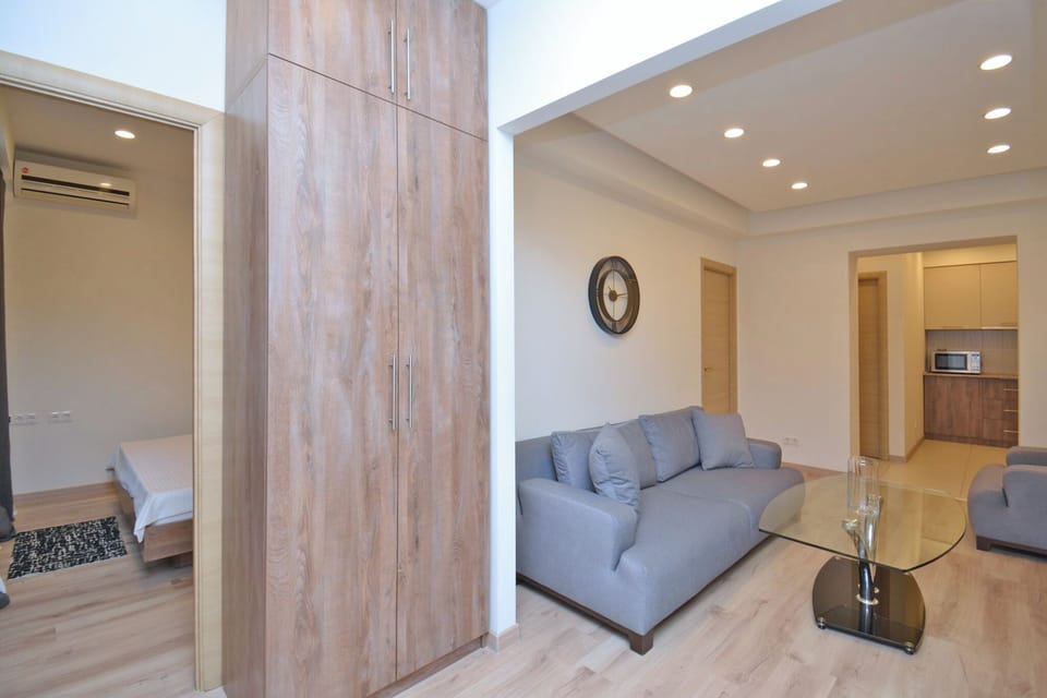 Family Apartment | Living area | 50-inch flat-screen TV with cable channels
