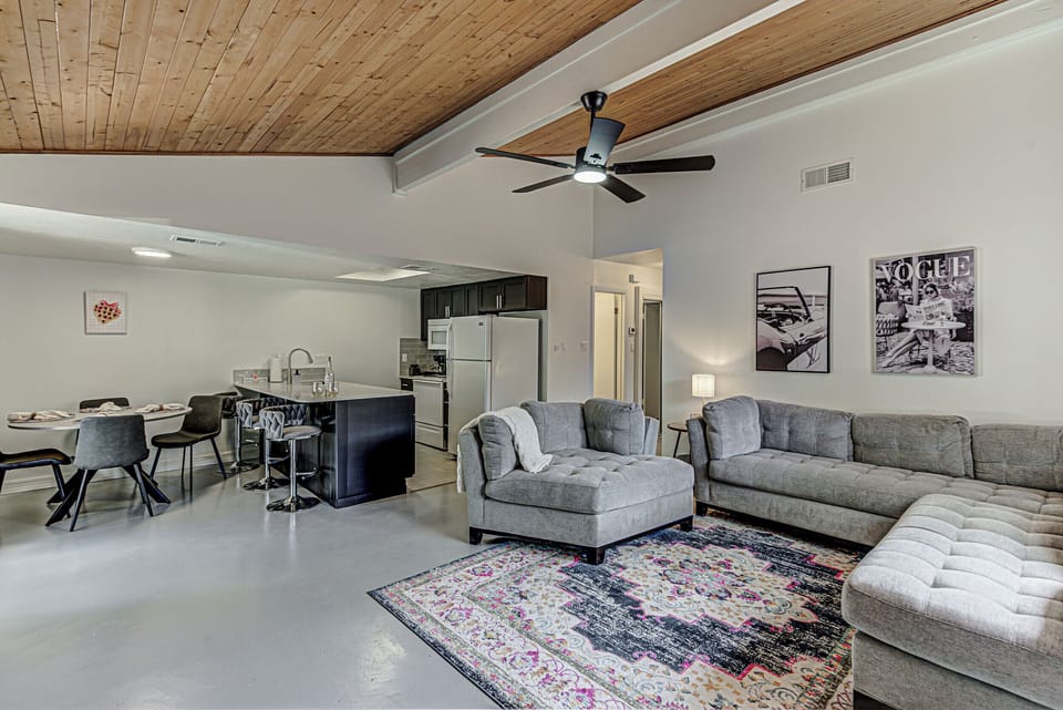 Comfy, spacious, living area with room darkening curtains and Roku TV
