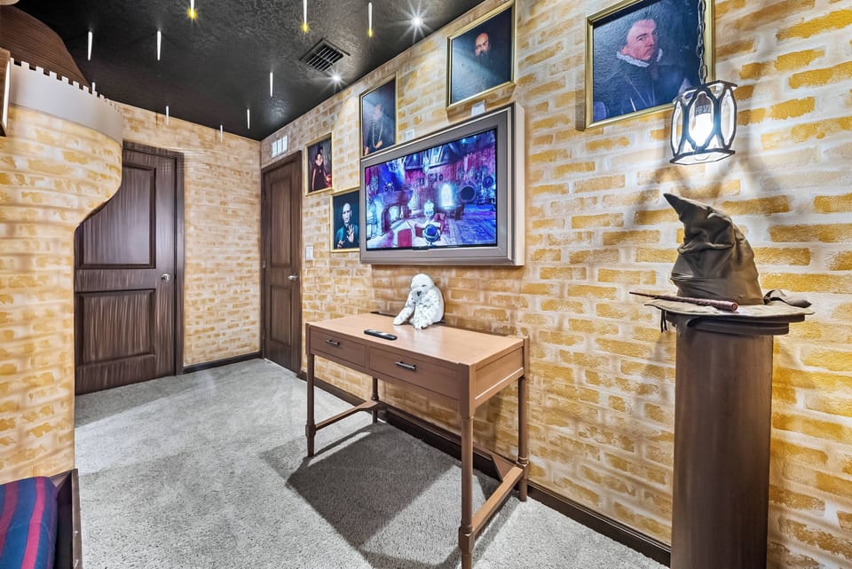Welcome to this charming entryway with a warm brick wall that adds character. A stylish wooden console table, adorned with artful decor and soft lighting, creates an inviting atmosphere for you and your guests.