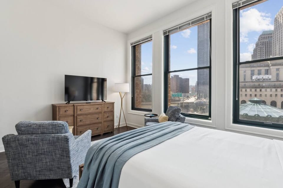 Wake up to sweeping city views from a bright corner room.