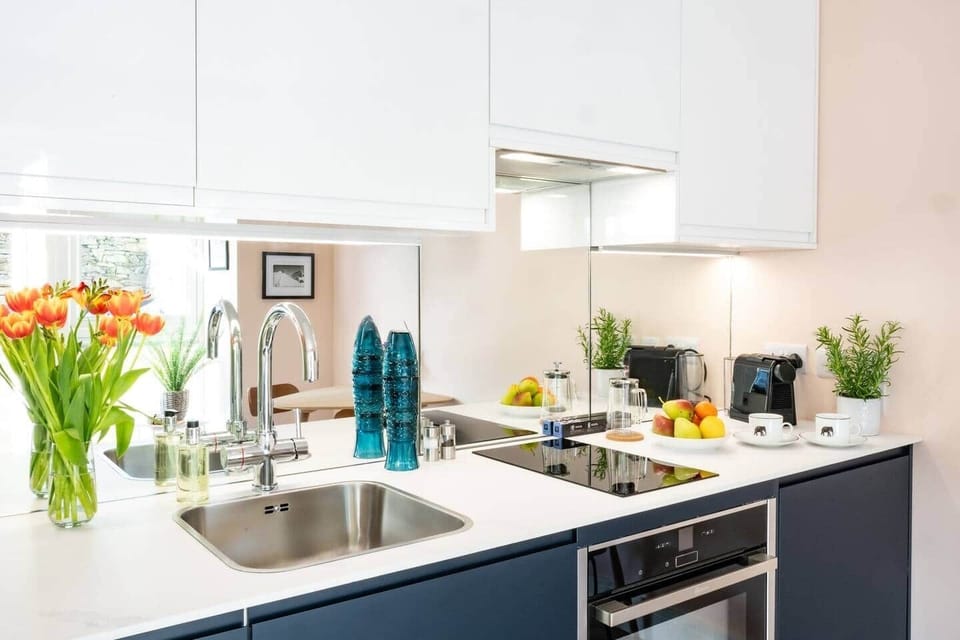 Lower ground basement open plan living/kitchen area with modern appliances and nespresso coffee machine.