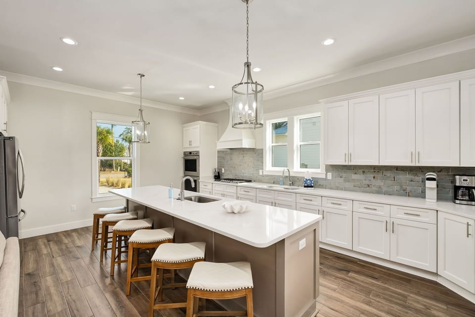 Thoughtfully appointed kitchen featuring double ovens, modern appliances, and generous prep space for every meal.