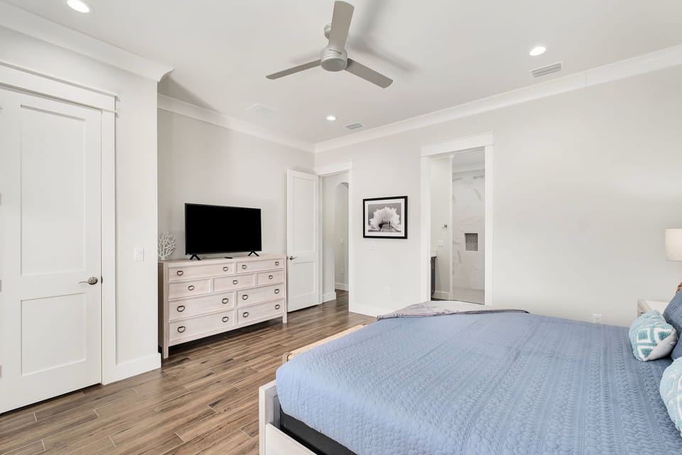 Wake up to peaceful balcony views of the backyard oasis from your private suite.