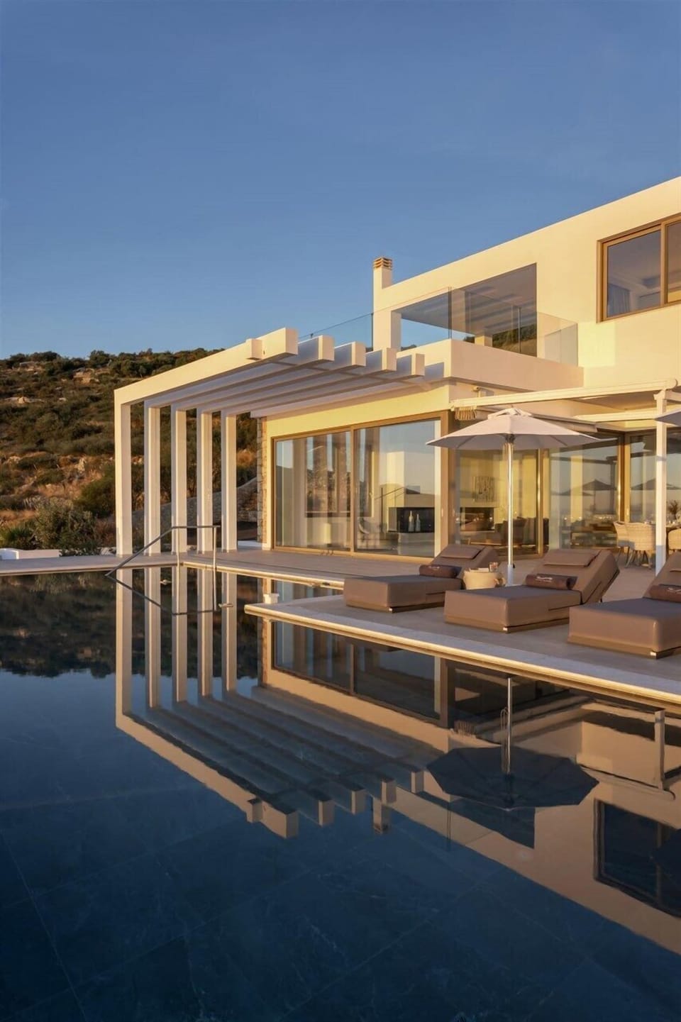 The villa reflected in the pool.