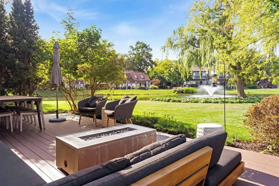 Pond view outdoor seating with fire pit