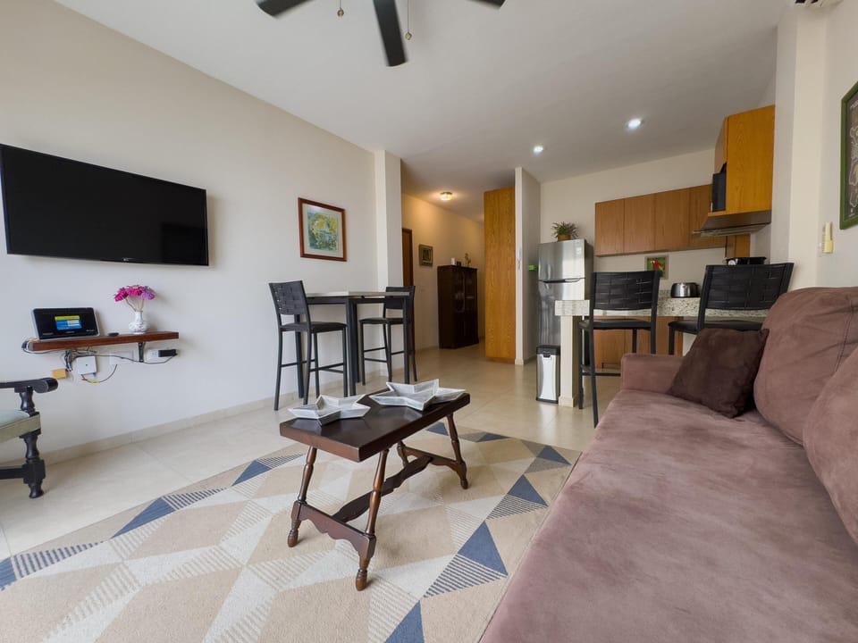 Cozy living room with open kitchen and modern comforts