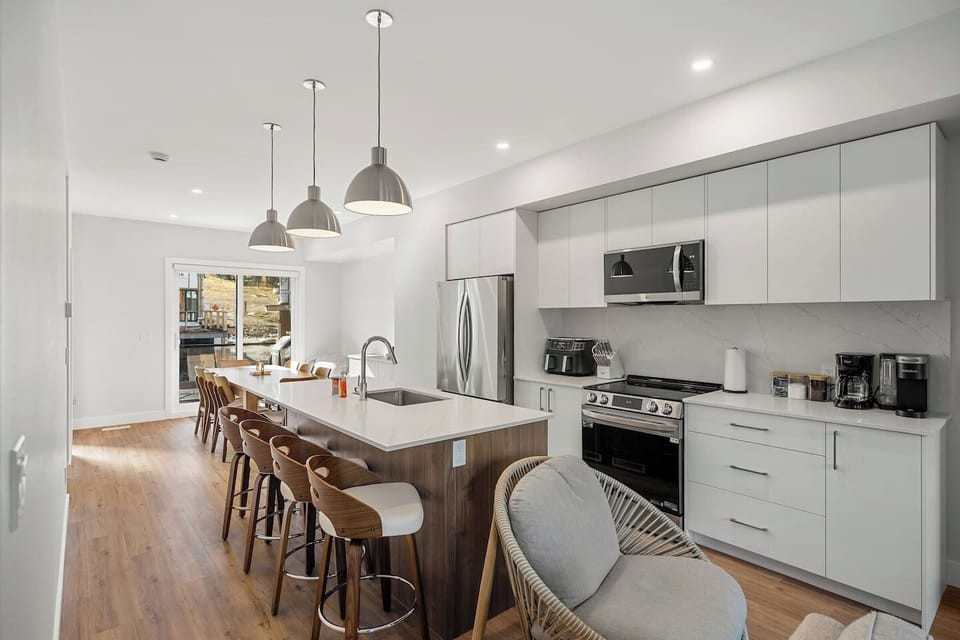 Full kitchen with a drip & keurig coffee machine, air fryer and a hand mixer.