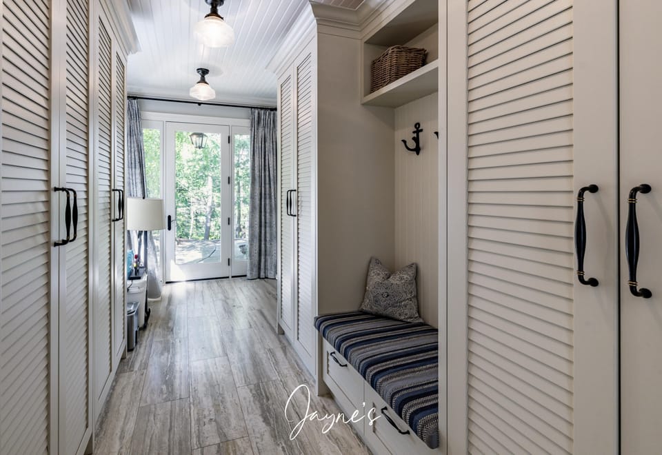 Bright, airy hallway with cozy built-in bench and storage