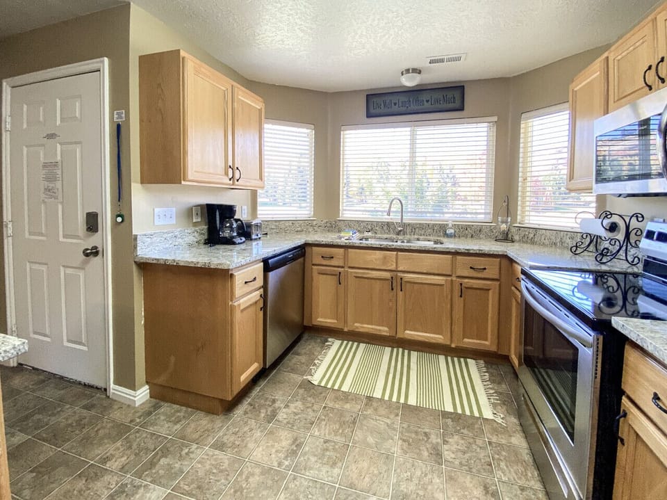 Bright corner kitchen filled with natural light and scenic views