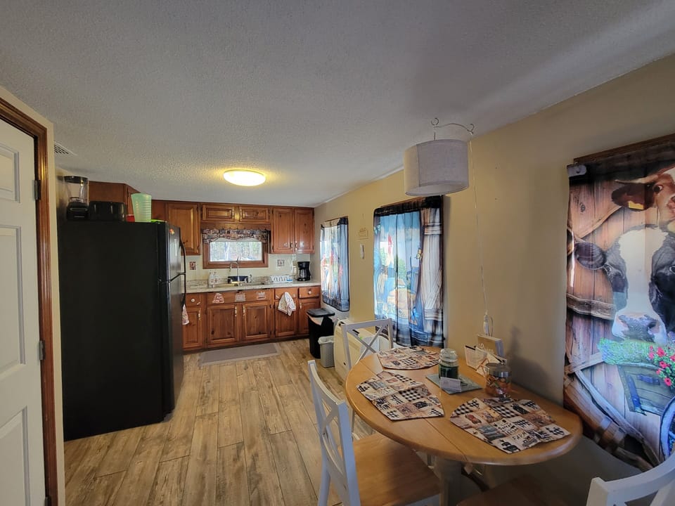 long view of dining area into kitchen