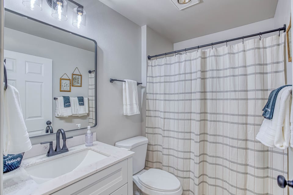 2nd bathroom with shower/tub located in the hallway.  