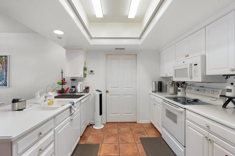 Sliding doors to the pantry and laundry room seal off from kitchen.