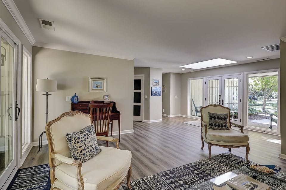 Second living area featuring plenty of seating and a beautiful view of the outdoors.