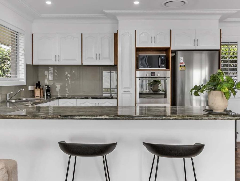 Open kitchen area connected to dining space.