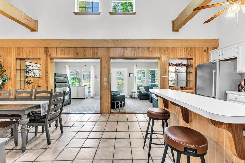 Open-concept space with beautiful lake views through the dining and family room.