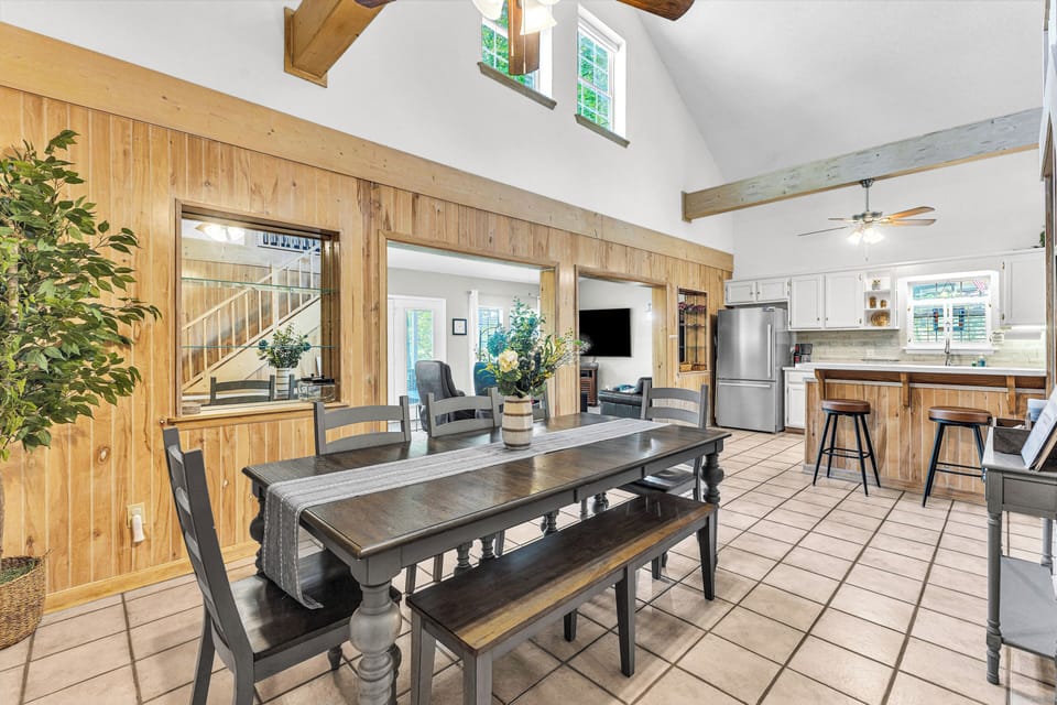 Open, airy dining space with comfortable seating for 8 and room to gather.
