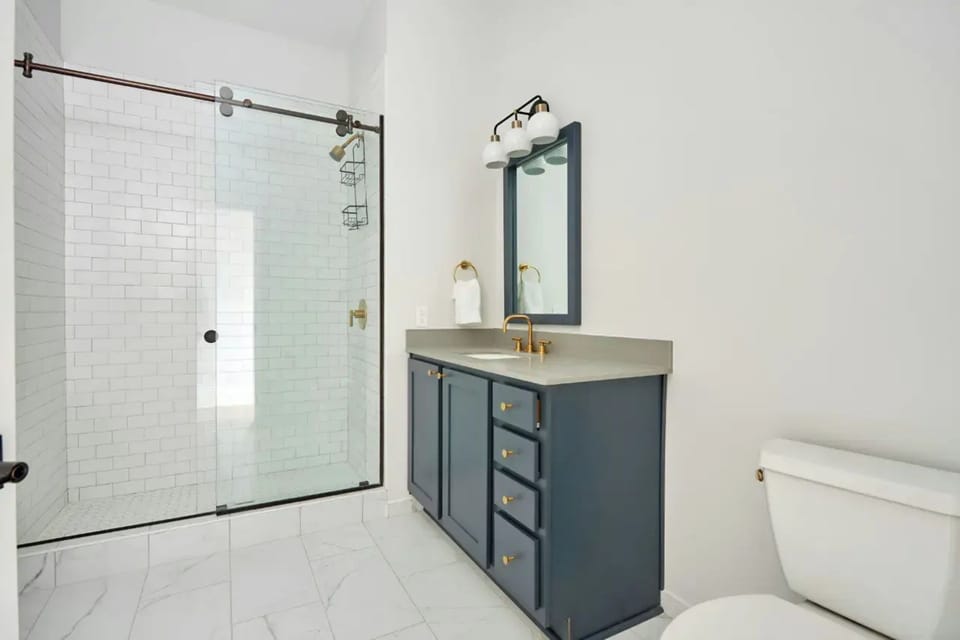 Full bathroom features a shower.