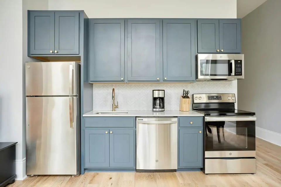 Fully equipped kitchen area with ample counter space.