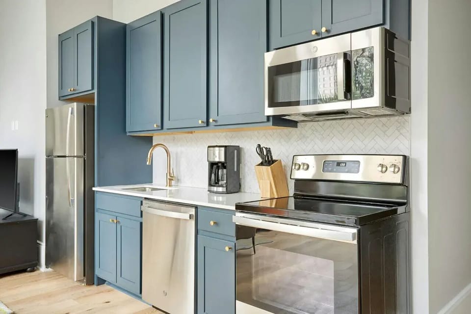 Fully equipped kitchen area with ample counter space.