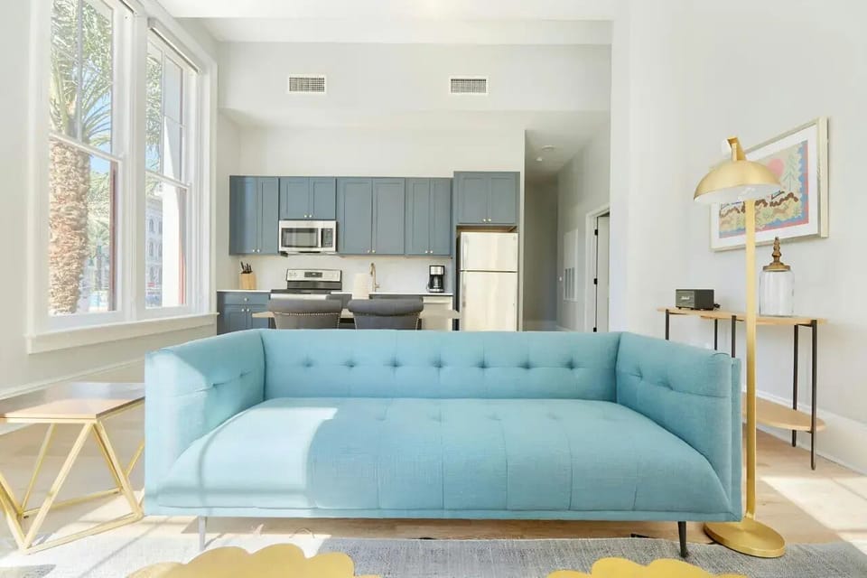 Bright and airy living room with plush seating and a TV to keep you entertained.