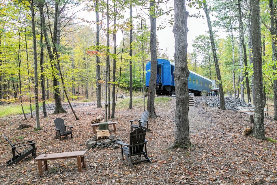 Outside area equipped with a fire pit, solar powered lighting , and an area for grilling and lazing the day away in the hammock.
