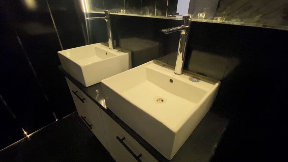 Separate tub and shower, hair dryer, slippers, towels