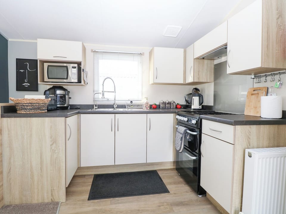 Fridge, microwave, toaster, cookware/dishes/utensils