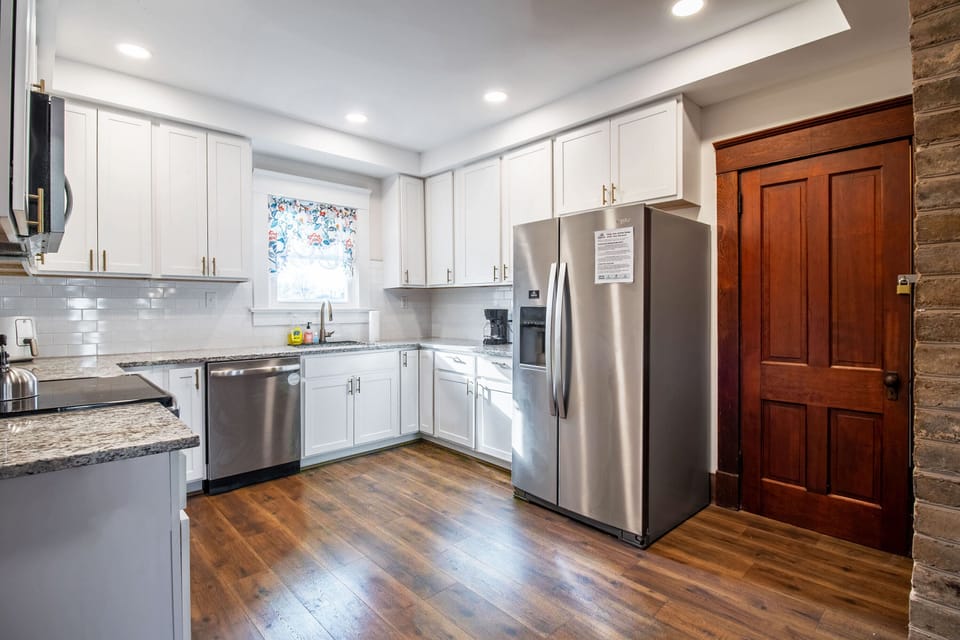Full kitchen with stove top, oven, microwave, refrigerator, dishwasher, and more!